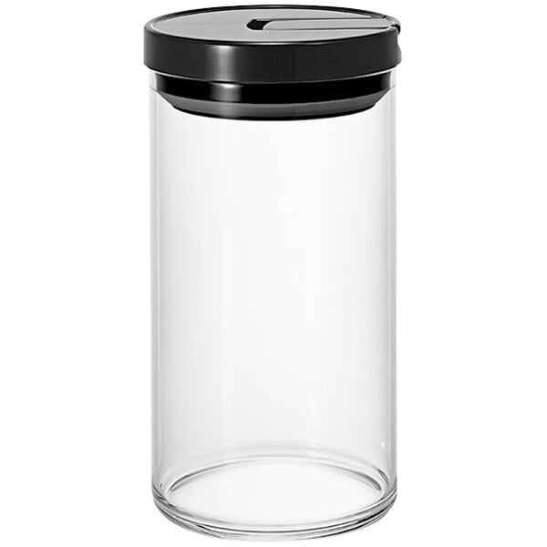 A clear glass Hario canister with a black lid.