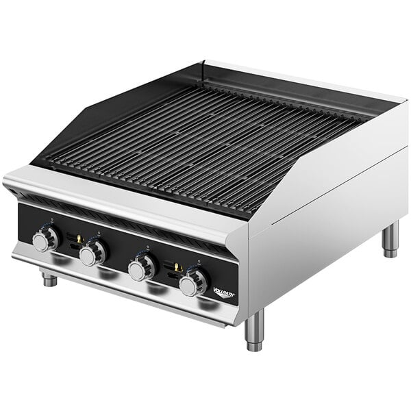 A Vollrath stainless steel charbroiler with knobs on a counter.