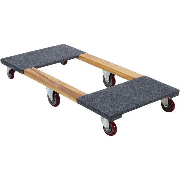 A Vestil hardwood dolly with black carpeted deck ends and wheels.