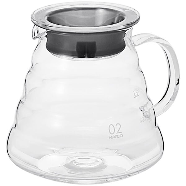 A clear glass Hario coffee server with a black lid and handle.