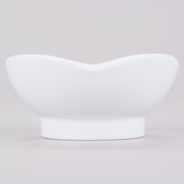 A white melamine bowl with a scalloped edge.