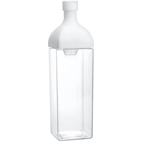 A clear plastic container with a white lid.