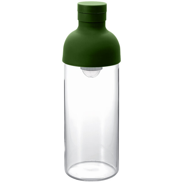 A clear container with a green lid.