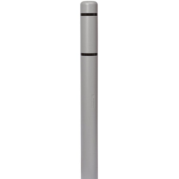 A close-up of a grey Innoplast BollardGard with black reflective stripes.