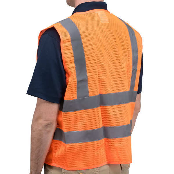 A person wearing a Cordova orange high visibility safety vest with reflective stripes.