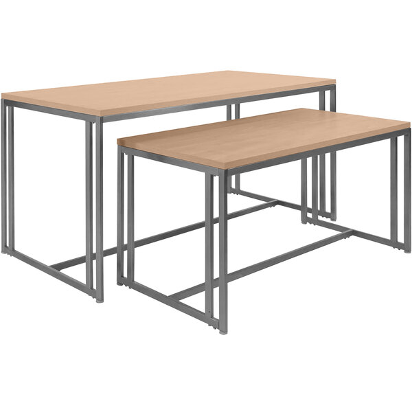 Two metal tables with maple tone tops and metal legs.