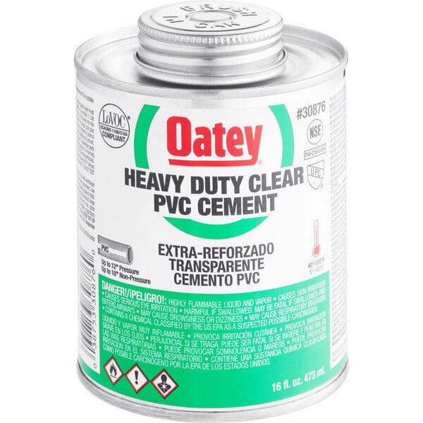 A white can of Oatey heavy duty clear PVC cement with a green label.