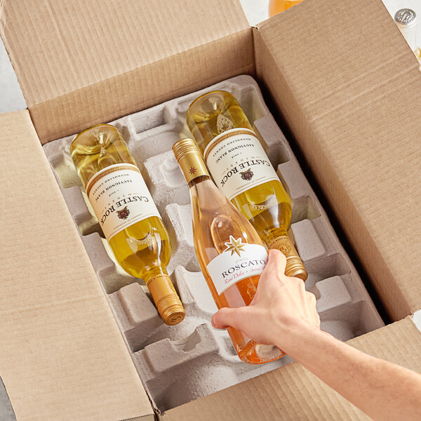 A hand opening a Lavex cardboard box with a bottle of wine inside.