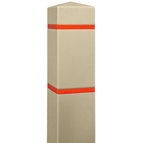 An Innoplast tan square bollard cover with orange and red stripes over a white post.