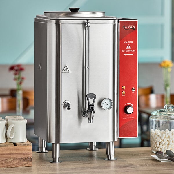 An Avantco stainless steel hot water dispenser on a counter.