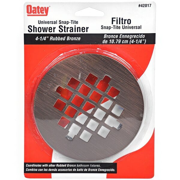 A package of Oatey Snap-Tite shower drain strainers with a circular metal strainer with holes in it.