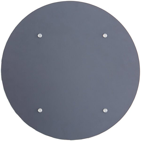 A round glass charger plate with jeweled accents.