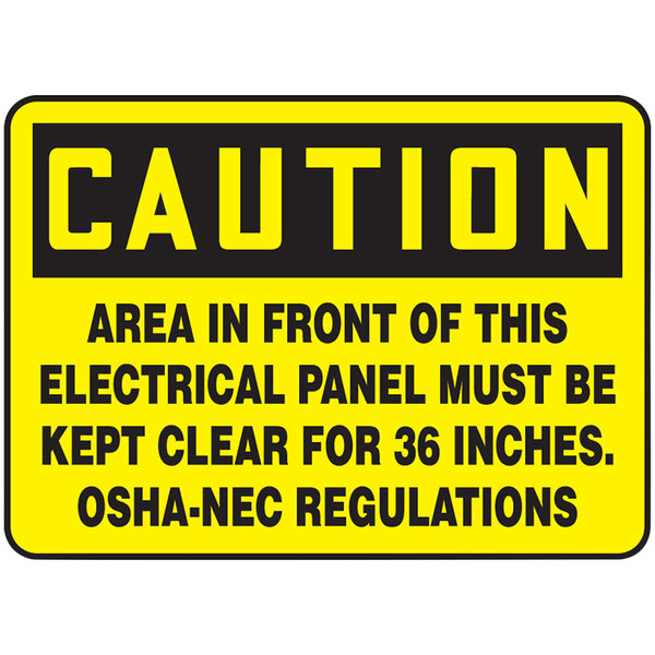 A yellow and black Accuform aluminum safety sign reading: "Caution / Area In Front Of Electrical Panel Must Be Kept Clear"