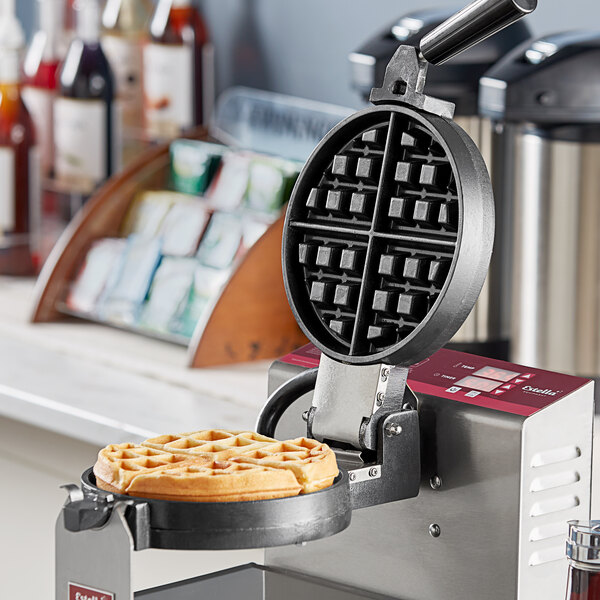 A waffle maker with a Belgian waffle plate inside.