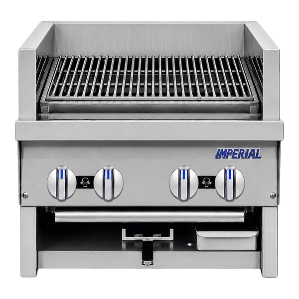 A stainless steel broiler with four control knobs, a grill grate on top, and an open compartment below.