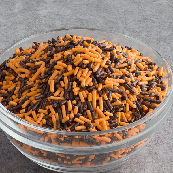 A bowl of Halloween sprinkles on a counter.