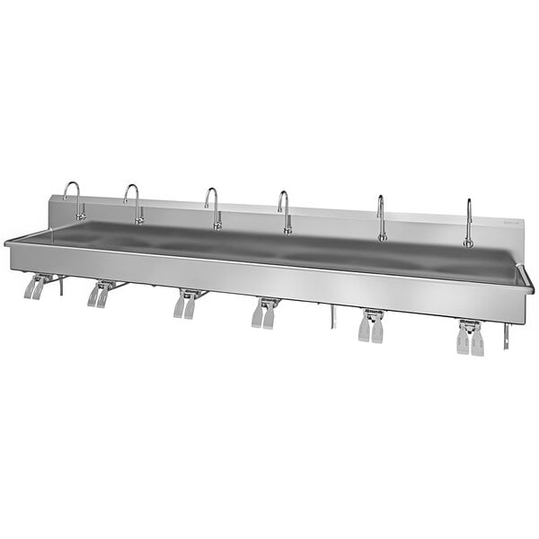A Sani-Lav stainless steel wall-mounted multi-station sink with knee-operated faucets.