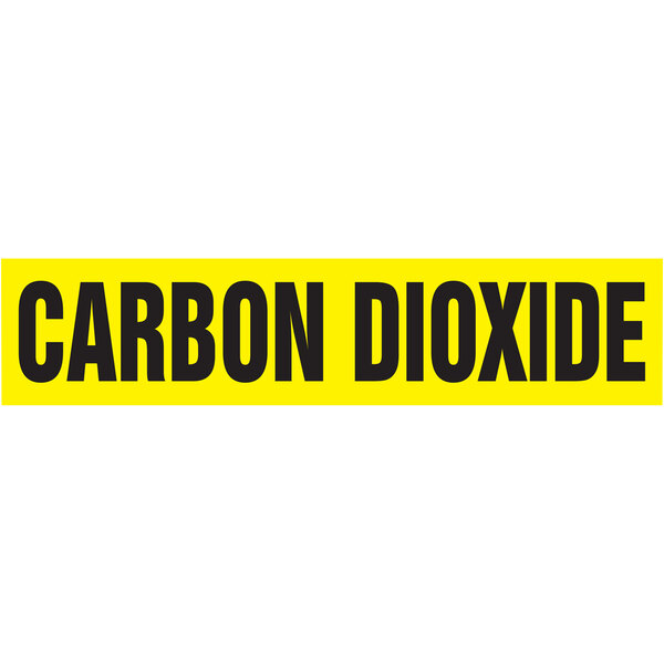 A white rectangular Accuform self-stick pipe marker with yellow and black text reading "Carbon Dioxide"