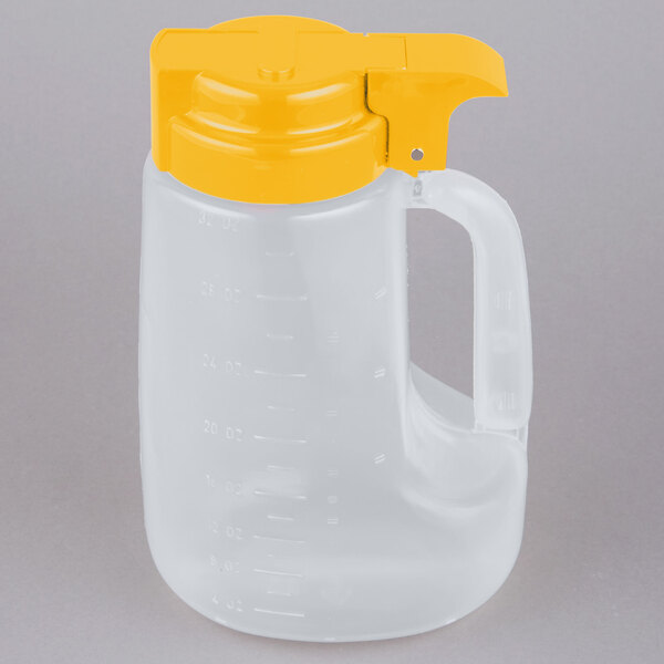 A white plastic jug with a yellow lid and handle.