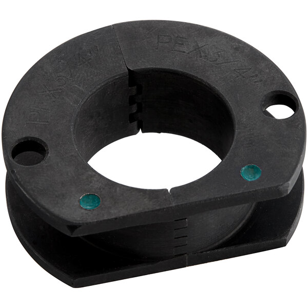 A black circular Zurn replacement head with green dots and holes.