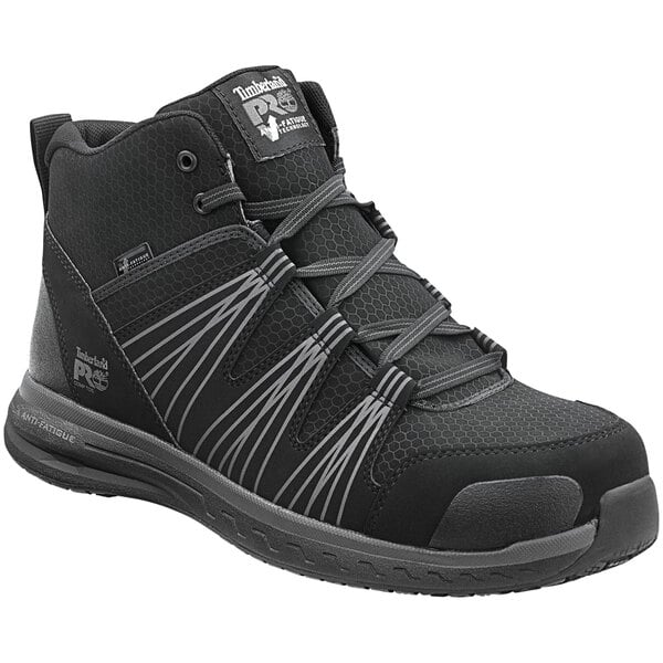 A black and grey Timberland Pro Powerdrive hiker boot with a composite toe.