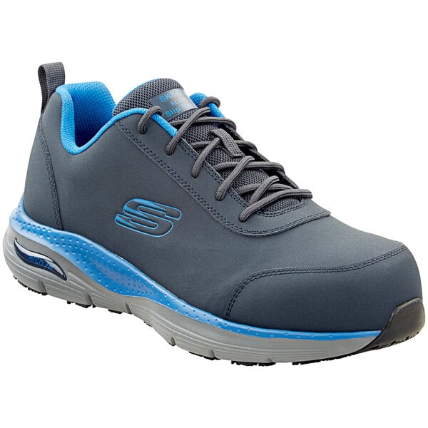 A Skechers navy and light blue work shoe with alloy toe and non-slip sole.