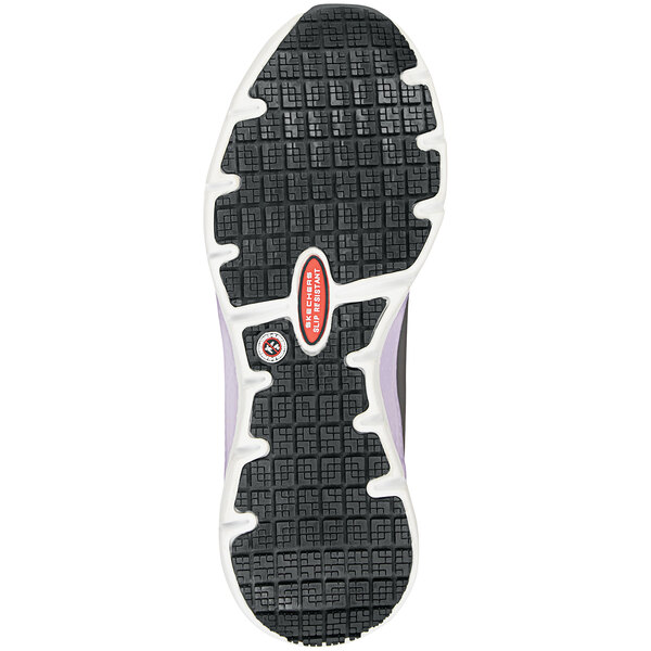 The sole of a gray and purple Skechers women's athletic shoe.