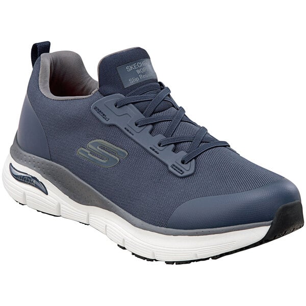 A close up of a navy Skechers Work Jake athletic shoe for men.