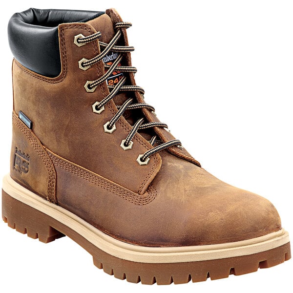 A Timberland PRO brown leather steel toe boot with black laces.