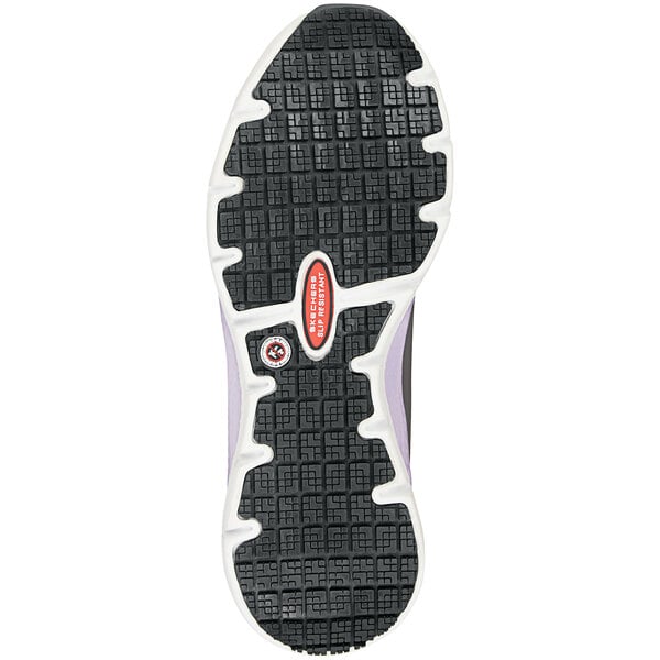 The black sole of a Skechers women's athletic shoe.