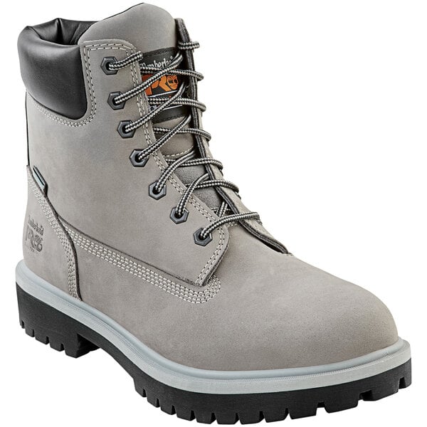 A pair of Timberland PRO steel toe leather boots in gray with black soles.