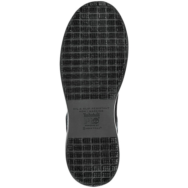 A close-up of a black Timberland PRO Powerdrive women's athletic shoe with a black sole.