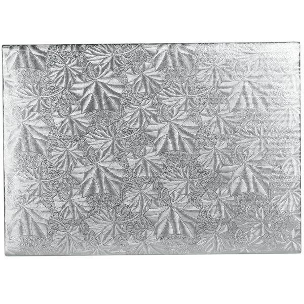 A close-up of the silver pattern on an Enjay silver rectangular cake board.