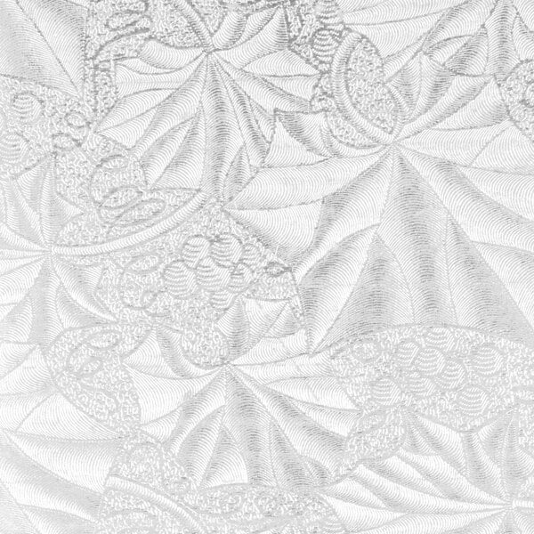 A close-up of a white Enjay cake board with leaves.