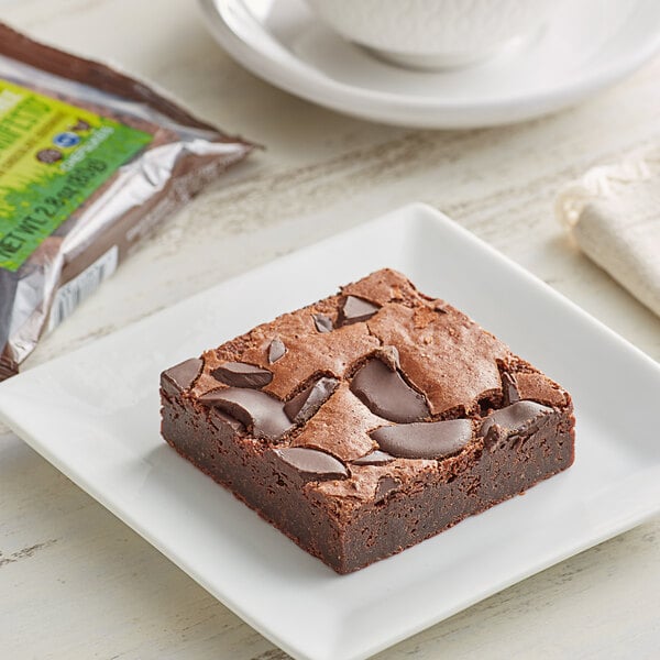 A Sweet Street Desserts gluten-free Honduran chocolate brownie on a square white plate.