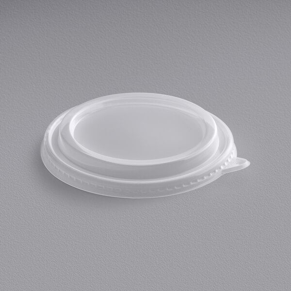 A white polypropylene lid for Choice round take-out containers.