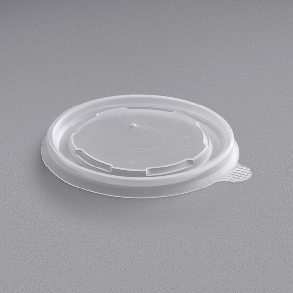 A white plastic lid with a lid on it.