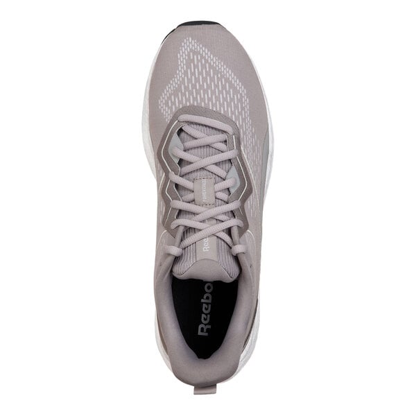 A gray and white Reebok men's athletic shoe with a soft toe and non-slip sole, shown from a top view.