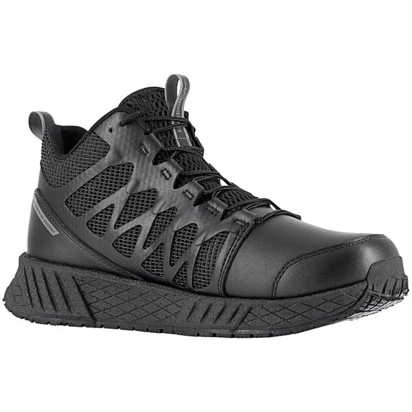 A pair of black Reebok Work Floatride Energy Tactical men's shoes with a composite toe on a white background.