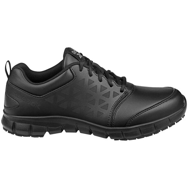 A pair of black Reebok Work Sublite athletic shoes for women with a white background.