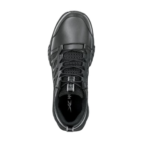 A black Reebok men's mid-high athletic shoe with a soft toe and non-slip sole, shown from a top view.