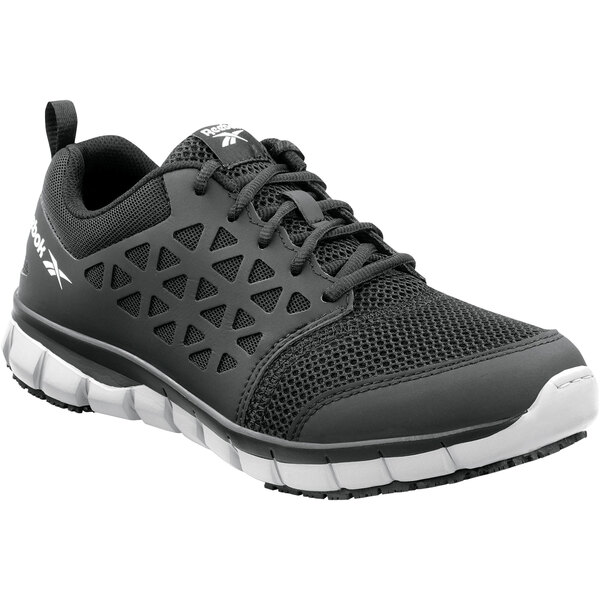 A black Reebok Work Sublite athletic shoe with a white sole.