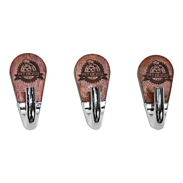 Three Pit Boss Rosewood magnetic tool hooks.