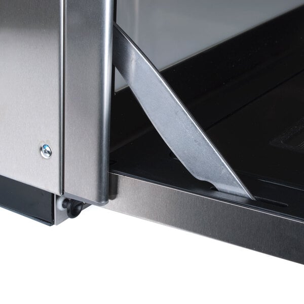 The stainless steel door of a Panasonic Sonic Steamer commercial microwave.