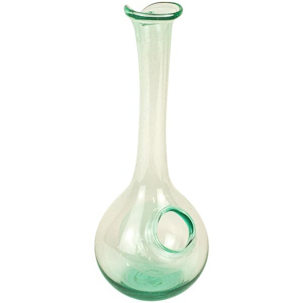 A clear glass vase with a hole in the bottom.