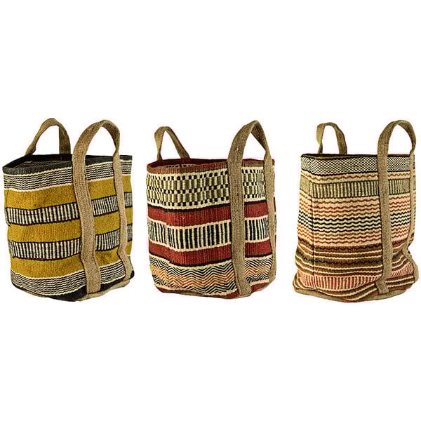 A close-up of a Kalalou woven display basket with yellow and black striped, blue, and pink handles.
