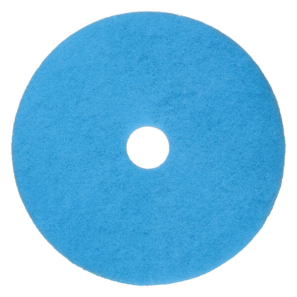 A blue Scrubble burnishing pad with a white center hole.