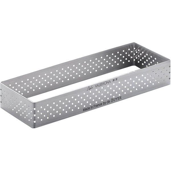 A rectangular metal tart ring with holes.
