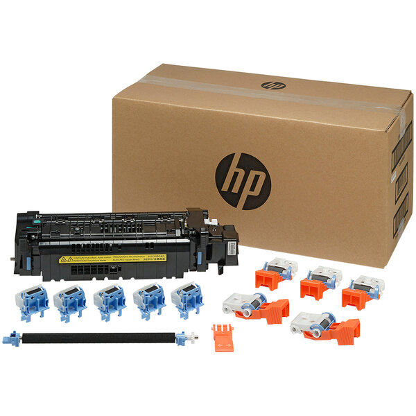 A box with HP LaserJet printer parts, including a toner cartridge kit.