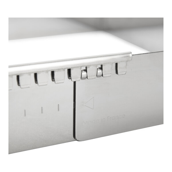 A de Buyer stainless steel square pan extender.